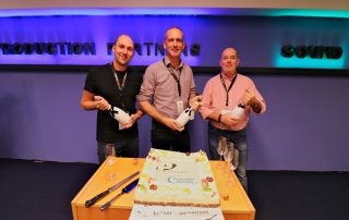 Patrick Botterman, Hans Peitsman en Ed de Bree proosten op overname Production Partners